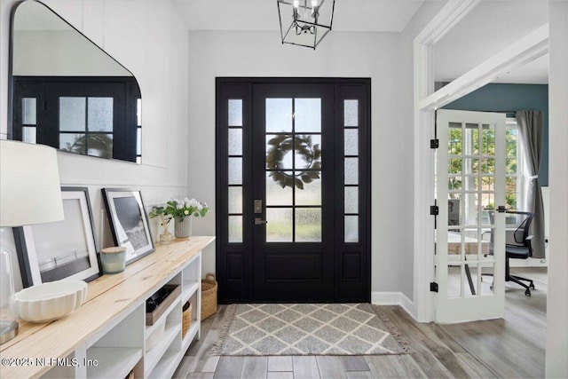395 Jennie Lake Ct, Saint Johns, FL 32095 - foyer with wood finished floors and a chandelier