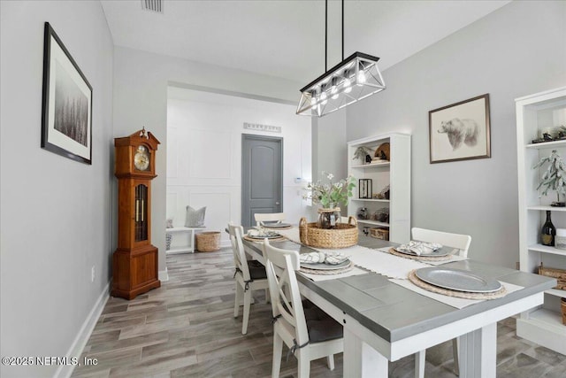 395 Jennie Lake Ct, Saint Johns, FL 32095 - dining room featuring a chandelier and light wood-style flooring