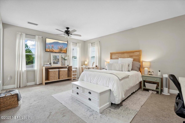 395 Jennie Lake Ct, Saint Johns, FL 32095 - bedroom featuring light colored carpet, multiple windows, and ceiling fan