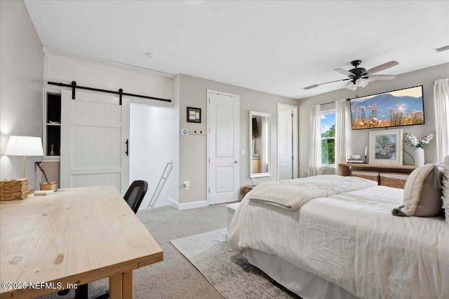 395 Jennie Lake Ct, Saint Johns, FL 32095 - bedroom featuring carpet, a barn door, a ceiling fan, and ensuite bath
