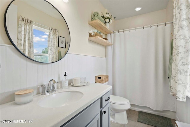 395 Jennie Lake Ct, Saint Johns, FL 32095 - full bath with vanity, a wainscoted wall, tile patterned floors, and shower / bath combination with curtain