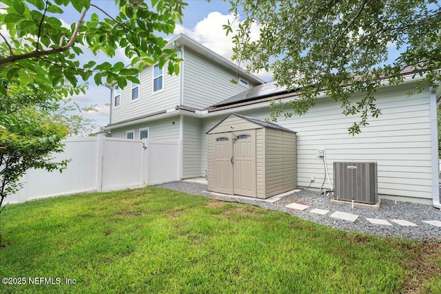 395 Jennie Lake Ct, Saint Johns, FL 32095 - back of house with roof mounted solar panels and a storage shed