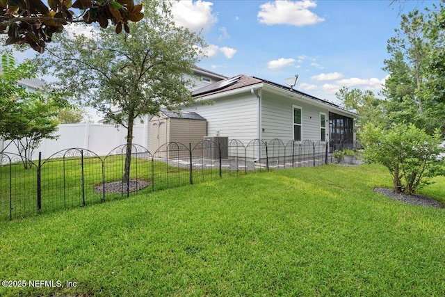 395 Jennie Lake Ct, Saint Johns, FL 32095 - view of home's exterior featuring a shed, solar panels, and a sunroom