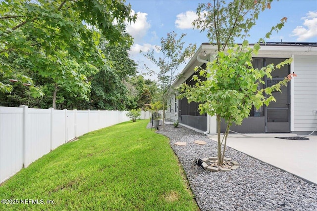 395 Jennie Lake Ct, Saint Johns, FL 32095 - fenced backyard featuring a patio area and a sunroom