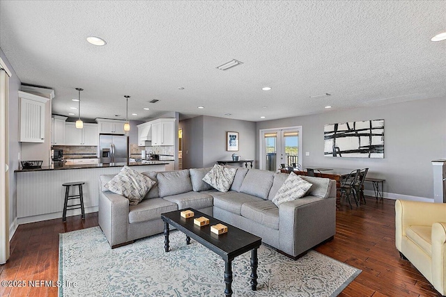 2481 S Ponte Vedra Blvd, Ponte Vedra Beach, FL 32082 - living area with a textured ceiling, dark wood-style flooring, and recessed lighting