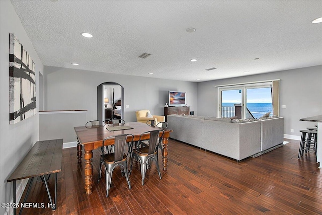 2481 S Ponte Vedra Blvd, Ponte Vedra Beach, FL 32082 - dining area featuring arched walkways, hardwood / wood-style flooring, a textured ceiling, and recessed lighting