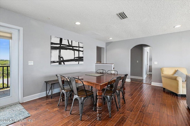 2481 S Ponte Vedra Blvd, Ponte Vedra Beach, FL 32082 - dining room with arched walkways, dark wood-type flooring, a textured ceiling, and recessed lighting