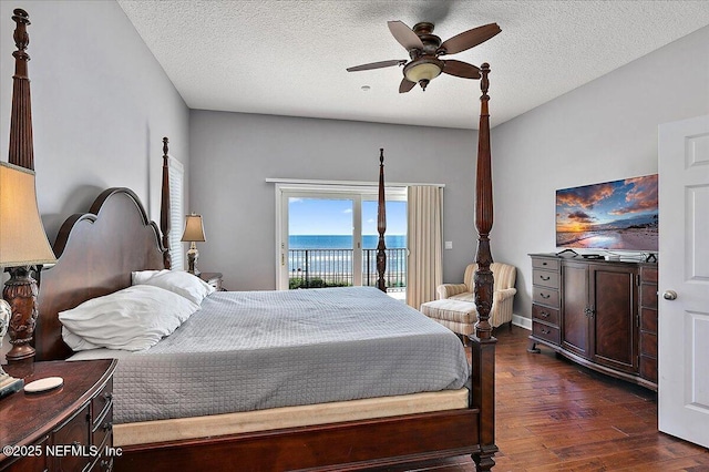 2481 S Ponte Vedra Blvd, Ponte Vedra Beach, FL 32082 - bedroom featuring access to exterior, dark wood-style flooring, a textured ceiling, and a ceiling fan