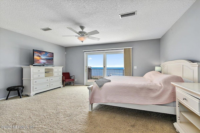 2481 S Ponte Vedra Blvd, Ponte Vedra Beach, FL 32082 - bedroom featuring access to exterior, light carpet, a ceiling fan, and a textured ceiling