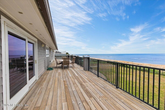 2481 S Ponte Vedra Blvd, Ponte Vedra Beach, FL 32082 - wooden terrace with outdoor dining area, a water view, and a yard