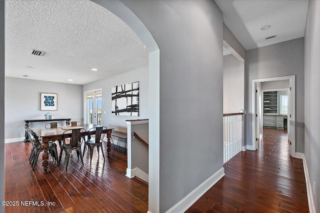2481 S Ponte Vedra Blvd, Ponte Vedra Beach, FL 32082 - dining space with a textured ceiling, hardwood / wood-style floors, arched walkways, and recessed lighting