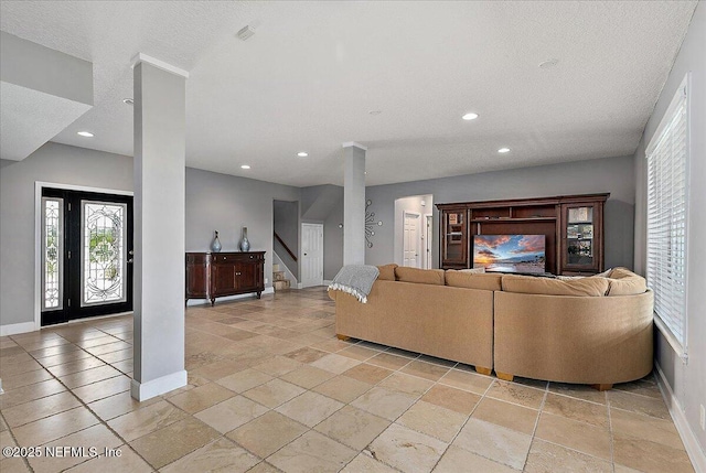 2481 S Ponte Vedra Blvd, Ponte Vedra Beach, FL 32082 - living area featuring recessed lighting, stone tile flooring, stairs, and decorative columns
