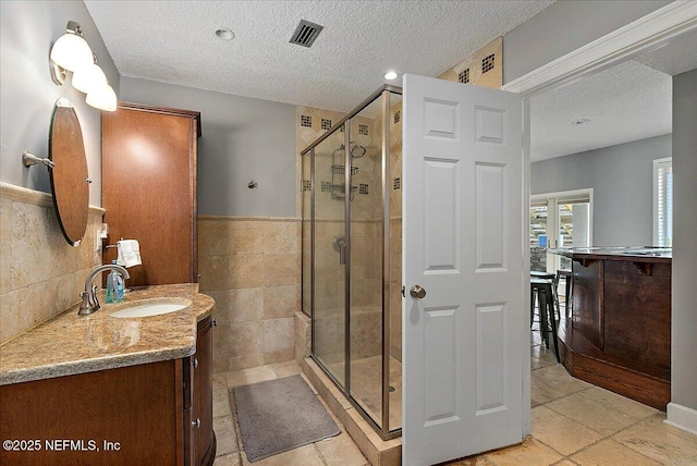 2481 S Ponte Vedra Blvd, Ponte Vedra Beach, FL 32082 - bathroom featuring a textured ceiling, vanity, a stall shower, and tile patterned floors
