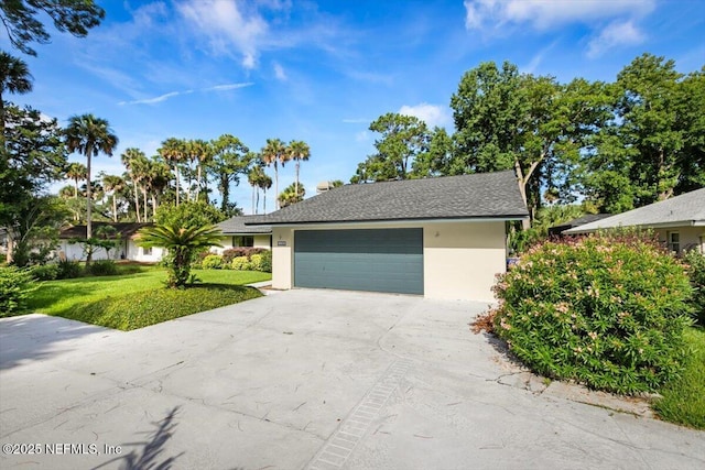 110 Abalone Ln W, Ponte Vedra Beach, FL 32082 - view of front of property with stucco siding, driveway, an attached garage, and a front lawn