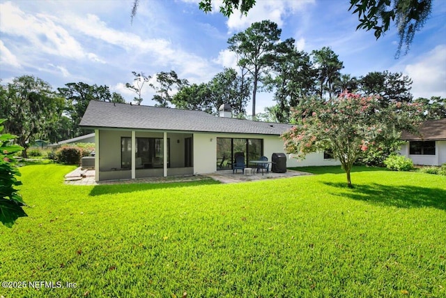 110 Abalone Ln W, Ponte Vedra Beach, FL 32082 - back of property featuring a lawn, a patio area, stucco siding, and a sunroom