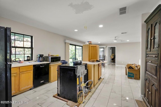 110 Abalone Ln W, Ponte Vedra Beach, FL 32082 - kitchen featuring black appliances, light marble finish floors, light countertops, recessed lighting, and a ceiling fan