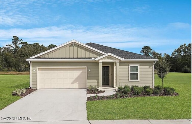 179 Charmer Trce, Saint Augustine, FL 32092 - view of front of property featuring driveway, a front lawn, an attached garage, and board and batten siding