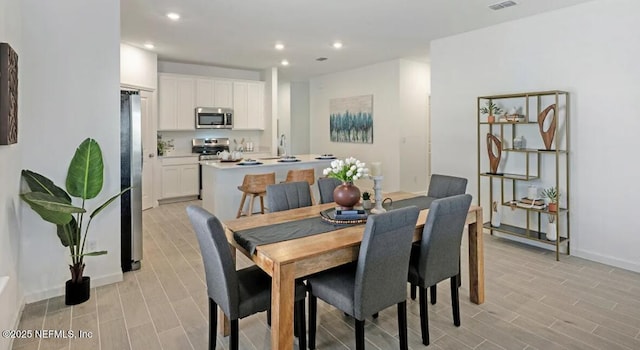 179 Charmer Trce, Saint Augustine, FL 32092 - dining space featuring light wood-type flooring and recessed lighting
