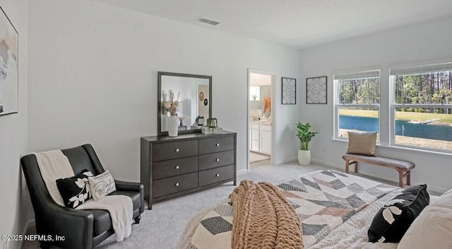179 Charmer Trce, Saint Augustine, FL 32092 - carpeted bedroom featuring connected bathroom and baseboards