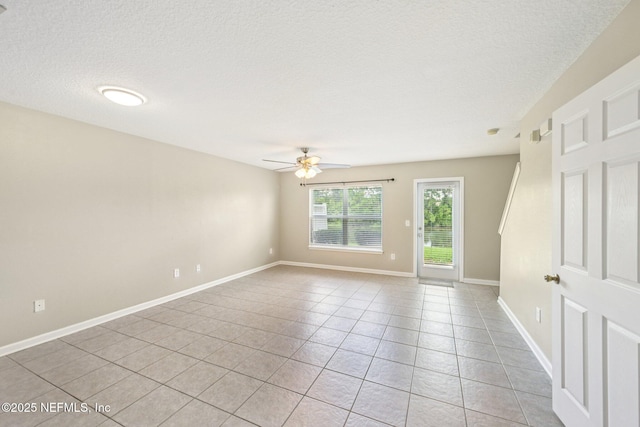 1500 Calming Water Dr Unit 4504, Fleming Island, FL 32003 - empty room featuring a ceiling fan, light tile patterned flooring, and a textured ceiling