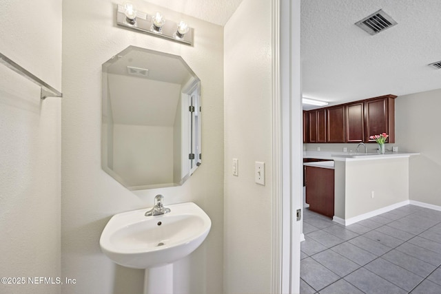 1500 Calming Water Dr Unit 4504, Fleming Island, FL 32003 - bathroom with tile patterned floors and a textured ceiling