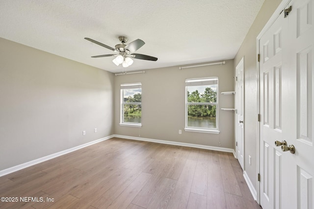 1500 Calming Water Dr Unit 4504, Fleming Island, FL 32003 - spare room with a ceiling fan, wood finished floors, and a textured ceiling
