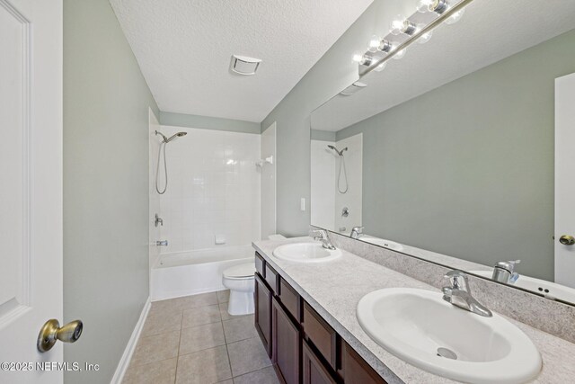 1500 Calming Water Dr Unit 4504, Fleming Island, FL 32003 - bathroom with shower / tub combination, double vanity, tile patterned flooring, and a textured ceiling