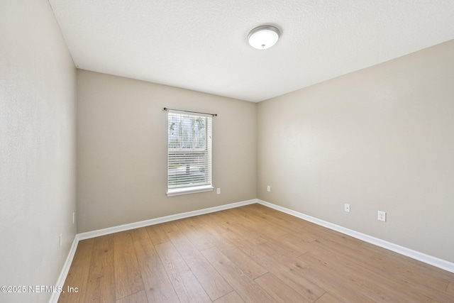 1500 Calming Water Dr Unit 4504, Fleming Island, FL 32003 - spare room with baseboards and light wood-style floors
