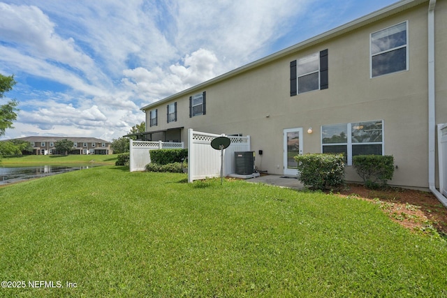 1500 Calming Water Dr Unit 4504, Fleming Island, FL 32003 - back of property featuring a water view and stucco siding