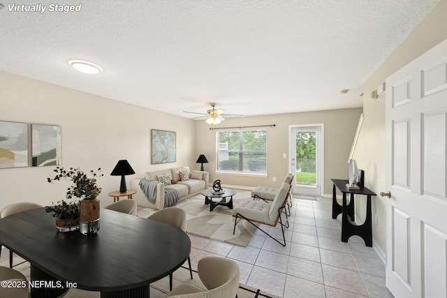 1500 Calming Water Dr Unit 4504, Fleming Island, FL 32003 - living area featuring light tile patterned flooring, a ceiling fan, and a textured ceiling