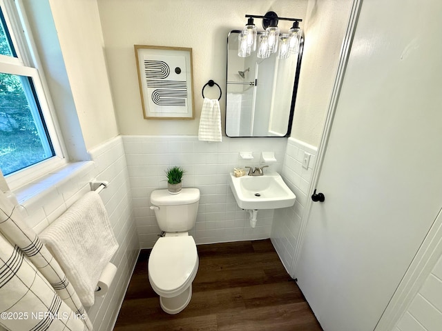 2536 Wedgefield Blvd, Jacksonville, FL 32211 - bathroom featuring wood finished floors, a wainscoted wall, and tile walls