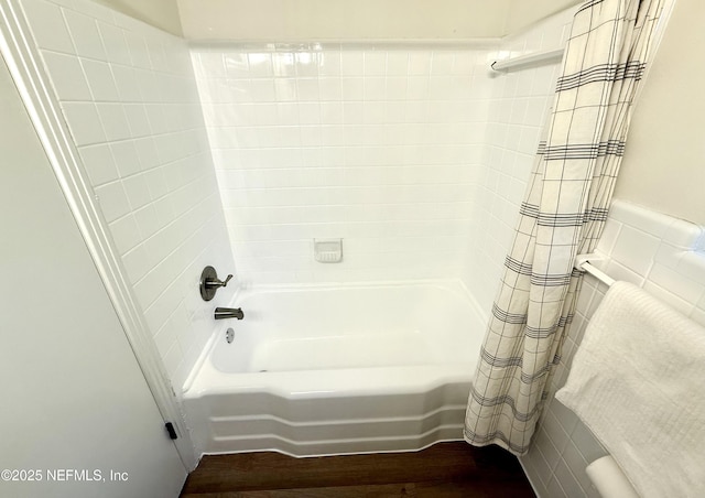 2536 Wedgefield Blvd, Jacksonville, FL 32211 - bathroom featuring wood finished floors and shower / bathtub combination with curtain
