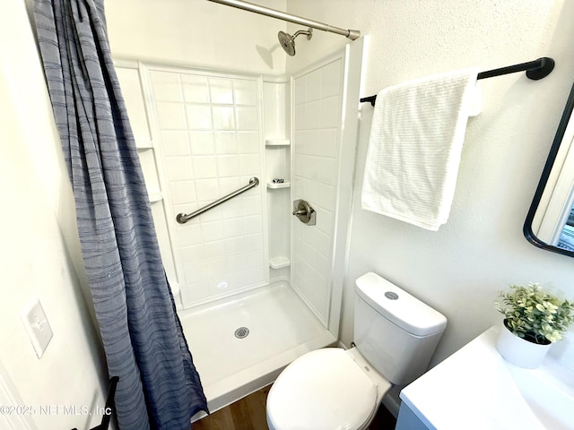 2536 Wedgefield Blvd, Jacksonville, FL 32211 - full bathroom featuring vanity, tiled shower, and wood finished floors