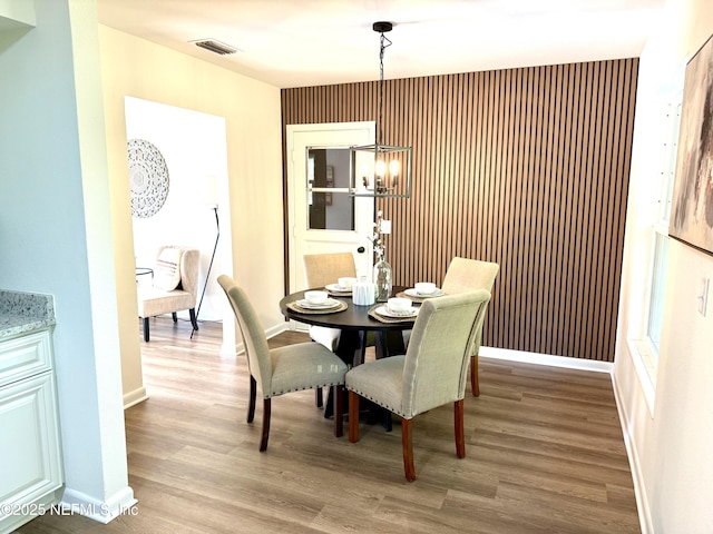 2536 Wedgefield Blvd, Jacksonville, FL 32211 - dining space with light wood-style flooring and a chandelier