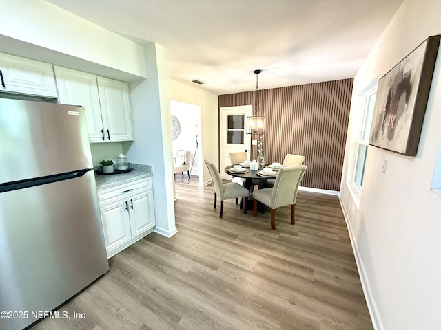 2536 Wedgefield Blvd, Jacksonville, FL 32211 - dining room with baseboards and light wood-type flooring