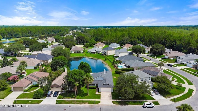 96220 Ridgewood Cir, Fernandina Beach, FL 32034 - aerial perspective of suburban area featuring a forest and a nearby body of water