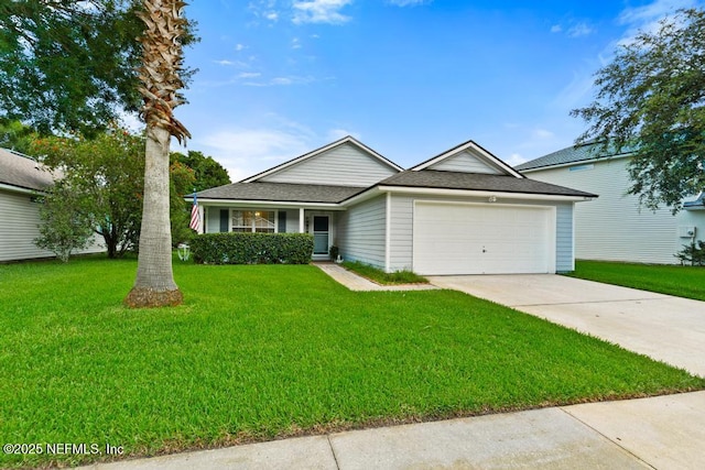 96220 Ridgewood Cir, Fernandina Beach, FL 32034 - view of front facade featuring an attached garage, driveway, a front yard, and a shingled roof