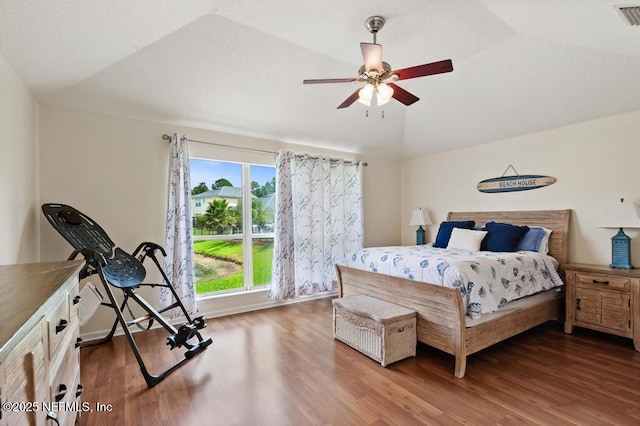 96220 Ridgewood Cir, Fernandina Beach, FL 32034 - bedroom featuring wood finished floors, lofted ceiling, and ceiling fan