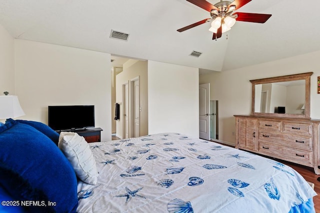 96220 Ridgewood Cir, Fernandina Beach, FL 32034 - bedroom with wood finished floors, vaulted ceiling, and ceiling fan