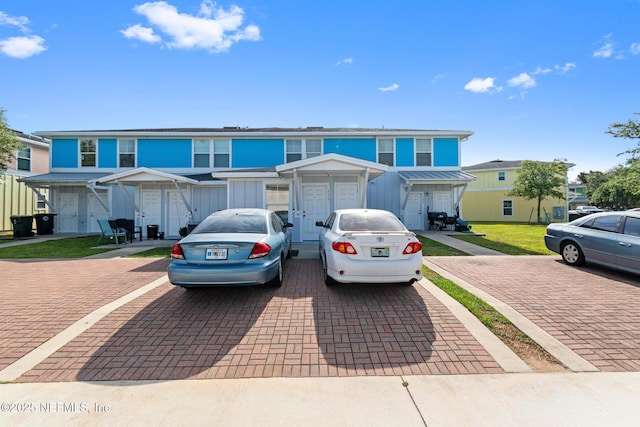 113 Oceangate Dr, Atlantic Beach, FL 32233 - traditional-style house featuring board and batten siding and uncovered parking