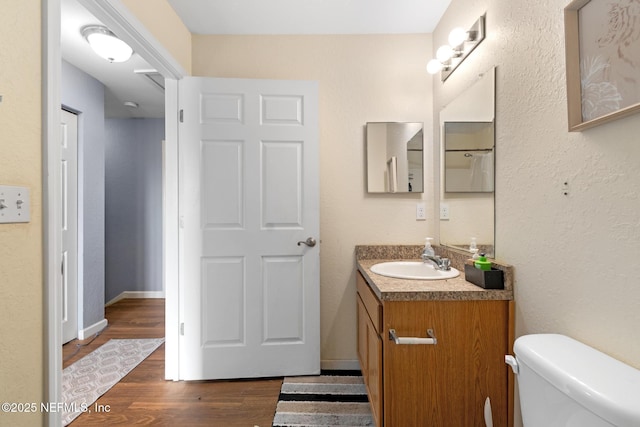 113 Oceangate Dr, Atlantic Beach, FL 32233 - bathroom featuring vanity and wood finished floors