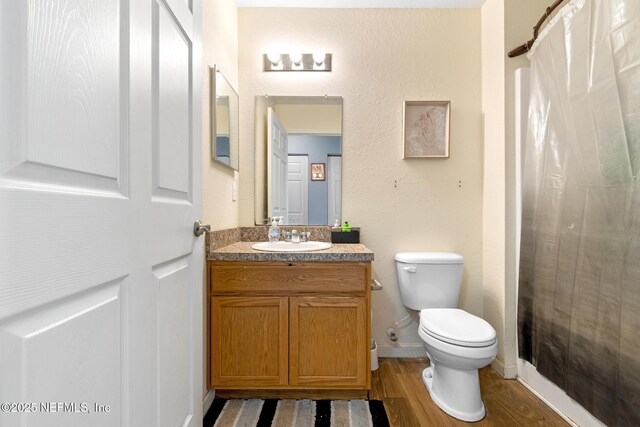 113 Oceangate Dr, Atlantic Beach, FL 32233 - full bath with vanity, wood finished floors, and a shower with curtain