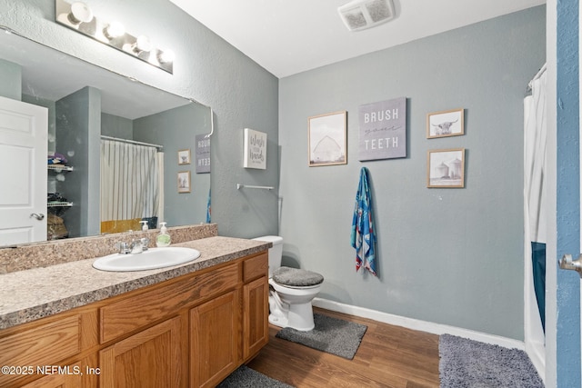 113 Oceangate Dr, Atlantic Beach, FL 32233 - bathroom featuring wood finished floors, vanity, and a shower with shower curtain