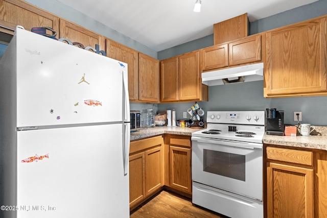 113 Oceangate Dr, Atlantic Beach, FL 32233 - kitchen featuring white appliances, under cabinet range hood, light countertops, and light wood-style floors