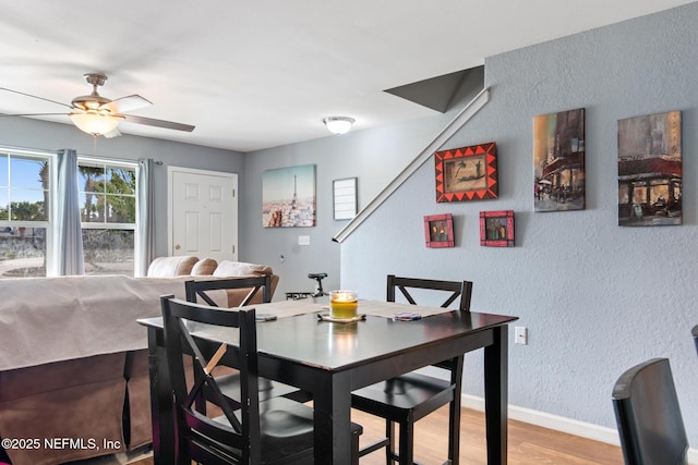 113 Oceangate Dr, Atlantic Beach, FL 32233 - dining space featuring a textured wall, light wood-type flooring, and a ceiling fan
