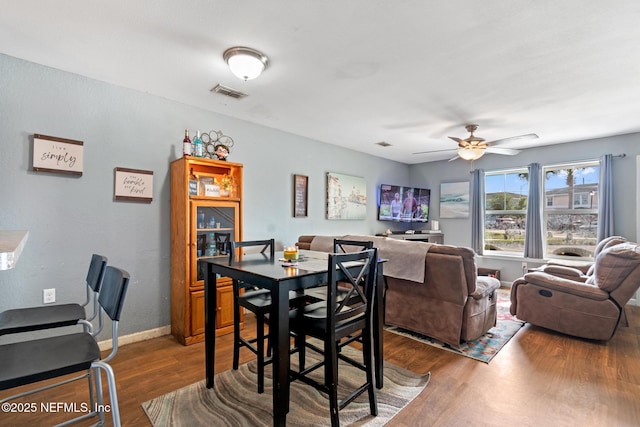 113 Oceangate Dr, Atlantic Beach, FL 32233 - dining space featuring a ceiling fan and wood finished floors