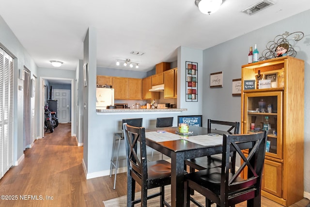 113 Oceangate Dr, Atlantic Beach, FL 32233 - dining space featuring wood finished floors and baseboards