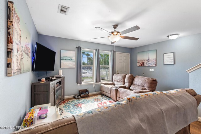 113 Oceangate Dr, Atlantic Beach, FL 32233 - living area featuring baseboards and ceiling fan