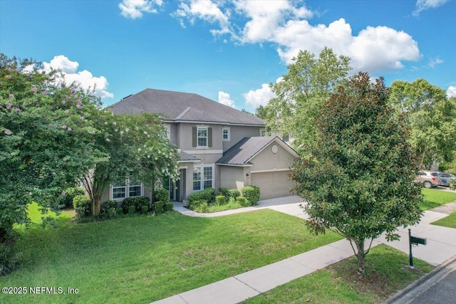 1415 Lantern Light Trl, Middleburg, FL 32068 - traditional-style house with stucco siding, driveway, a front yard, and an attached garage