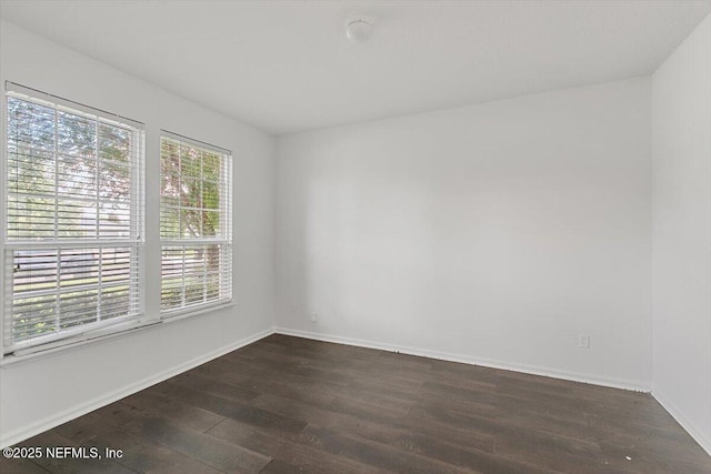 1415 Lantern Light Trl, Middleburg, FL 32068 - empty room featuring dark wood-type flooring and baseboards